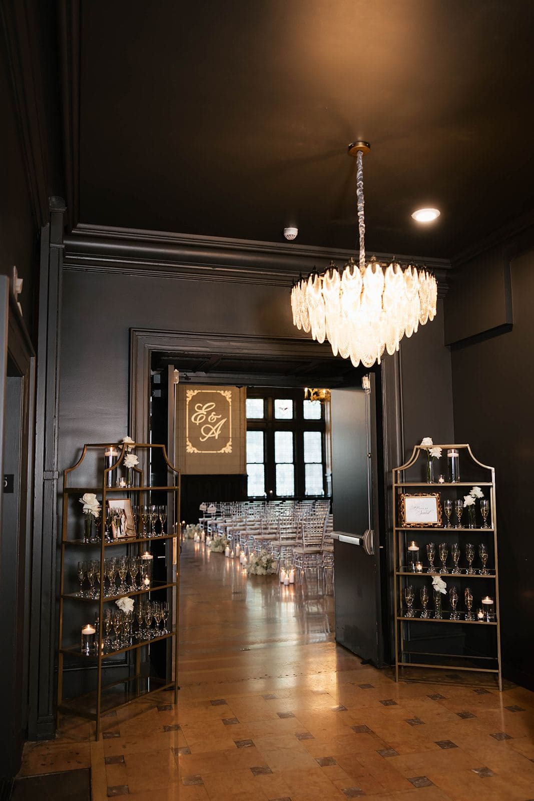 The cocktail lounge doorway, chandelier and bar shelving